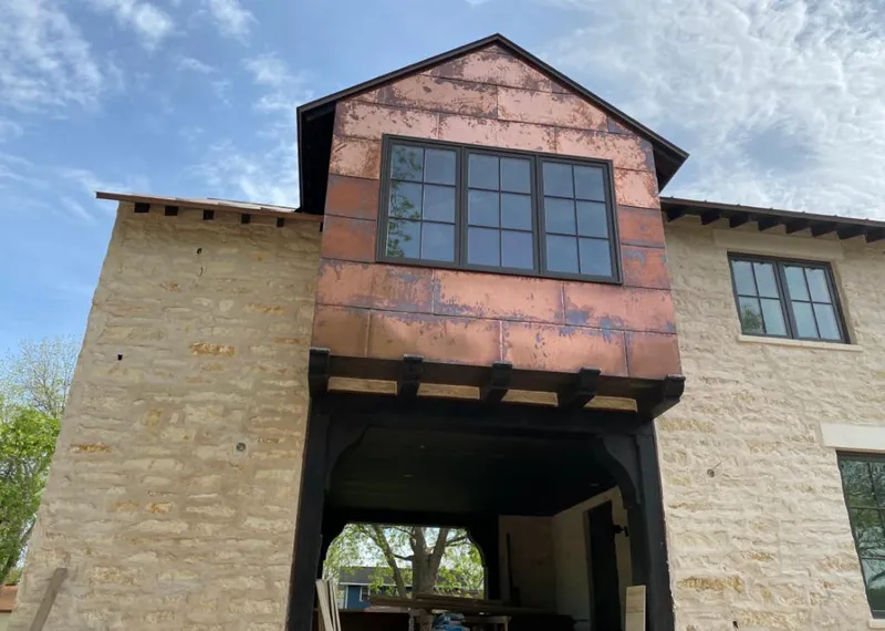 Copper metal panel facade on a stone building for Metal Roof Coating in Five Corners